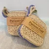 Two stacks of handmade cotton face scrubbies by Patient Calf packaged with "Handmade For You" and "Made in Canada" brown paper bands.