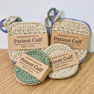 Close-up of Patient Calf handmade cotton scrubbies in square and round shapes, packaged with "Handmade For You" and "Made in Canada" brown paper bands.