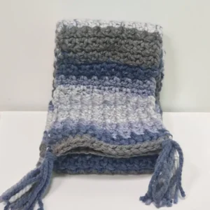 The Drina Scarf draped to show its full length and the varying shades of blue and grey stripes.