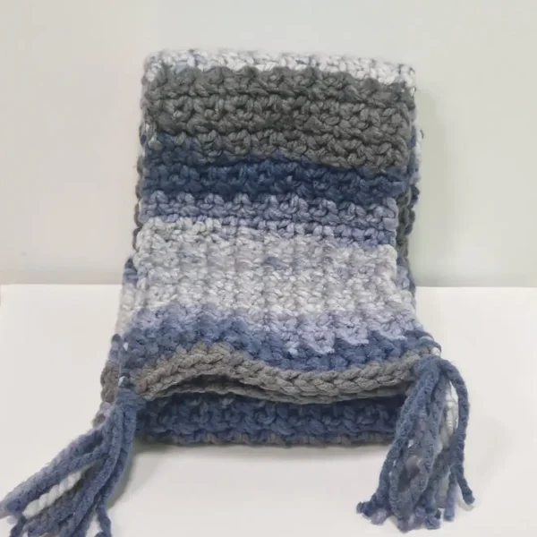 The Drina Scarf draped to show its full length and the varying shades of blue and grey stripes.