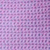 Close-up of the nubby, thick cotton crochet stitches on the Loire washcloth by Patient Calf.