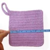 atient Calf Loire washcloth being measured with a blue tape measure, showing a width of 7.5 inches.