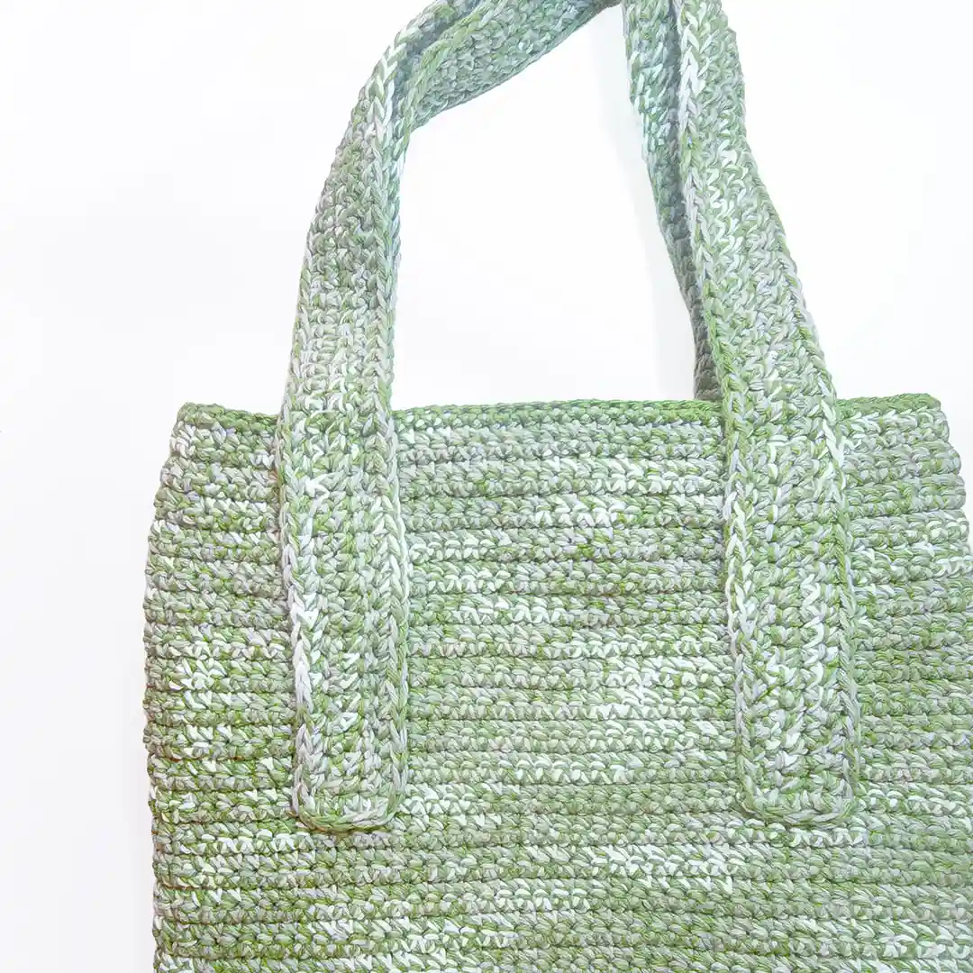 Close-up of the Rowan Tote straps and the clean, artisan finish of the Sage Green crochet.