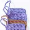 Three Iris scrubbies layered to show the neat square finish and sturdy hand-crocheted finger loops.