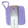 A soft lilac Iris scrubbie by Patient Calf shown with a ruler measuring 3 inches (7.6 cm) in height.