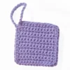 Close-up of the nubby, hand-crocheted texture of the Iris scrubbie in Soft Lilac by Patient Calf.