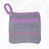 The Loire washcloth in a sage green, sweet rose, and soft lilac multi-colored cotton yarn with a sturdy hanging loop