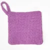 Full view of the Loire washcloth in solid Sweet Rose showing the sturdy crochet hanging loop