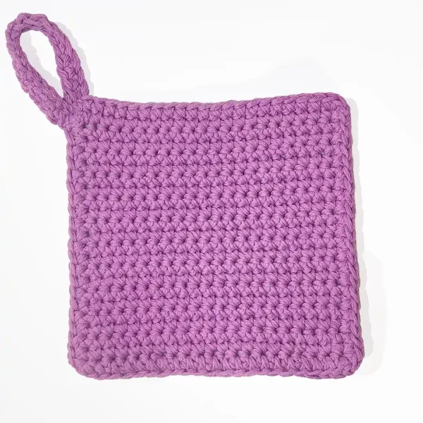 Full view of the Loire washcloth in solid Sweet Rose showing the sturdy crochet hanging loop